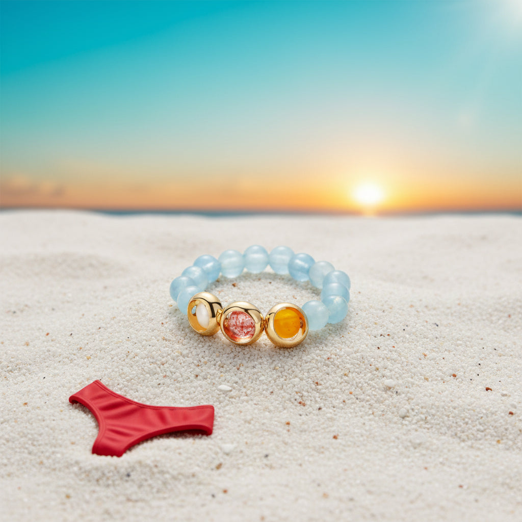 AQUAMARINE STRETCH RING WITH GOLD-FRAMED BEADS