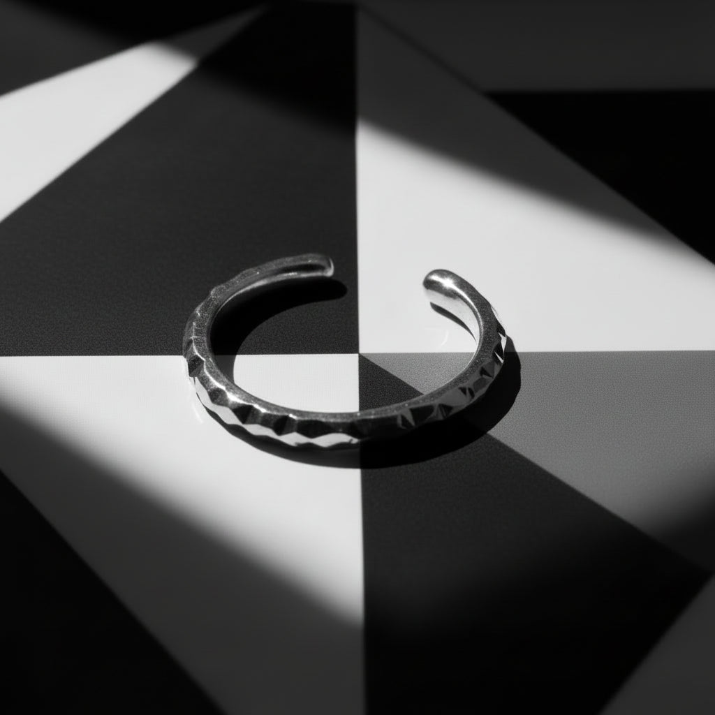 HIGH POLISH MACHINE CUT OPEN RING WITH FACETED TEXTURE