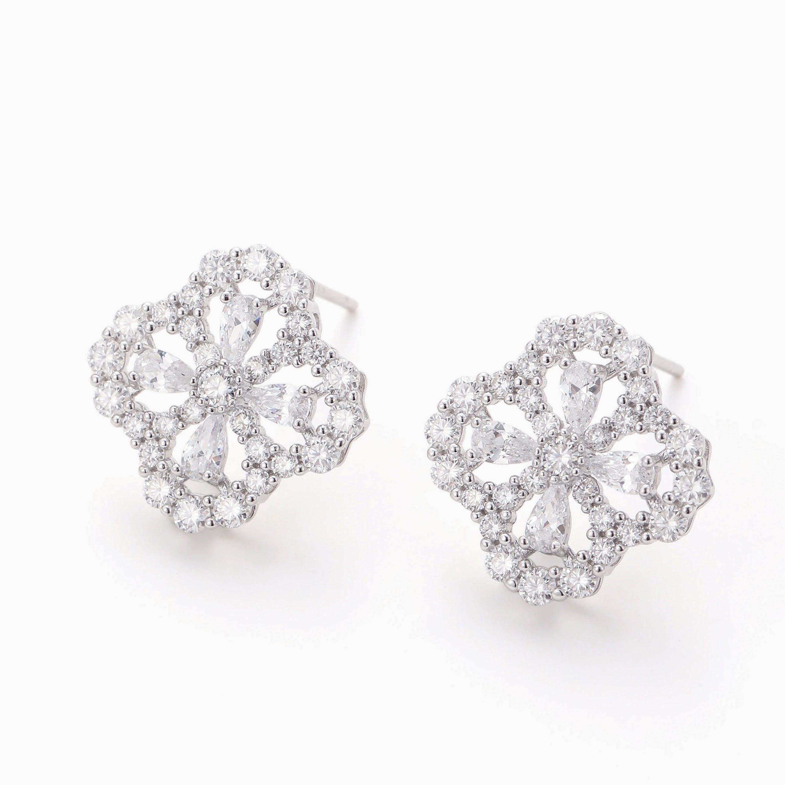DELICATE OPENWORK FLOWER MOISSANITE STUDS