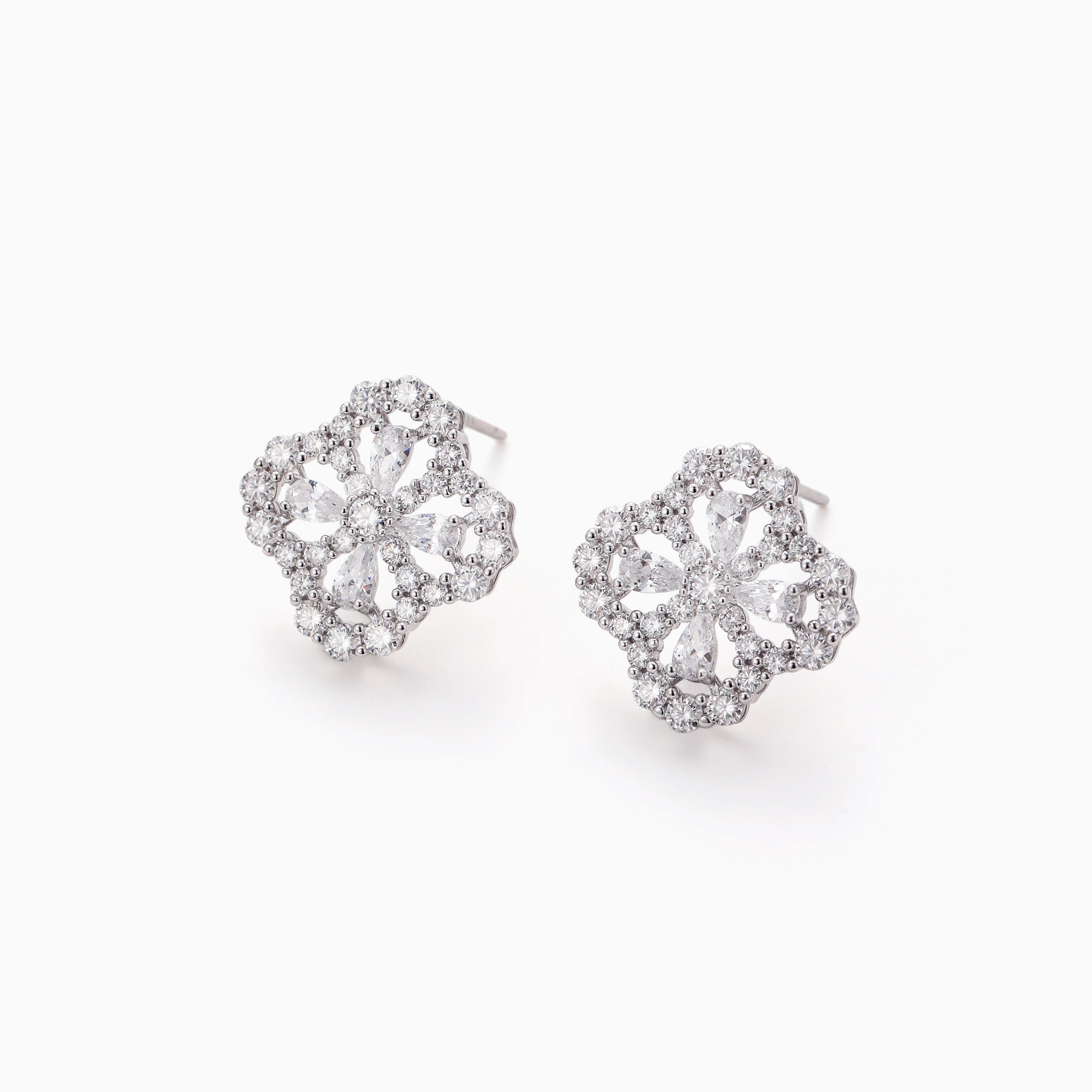 DELICATE OPENWORK FLOWER MOISSANITE STUDS