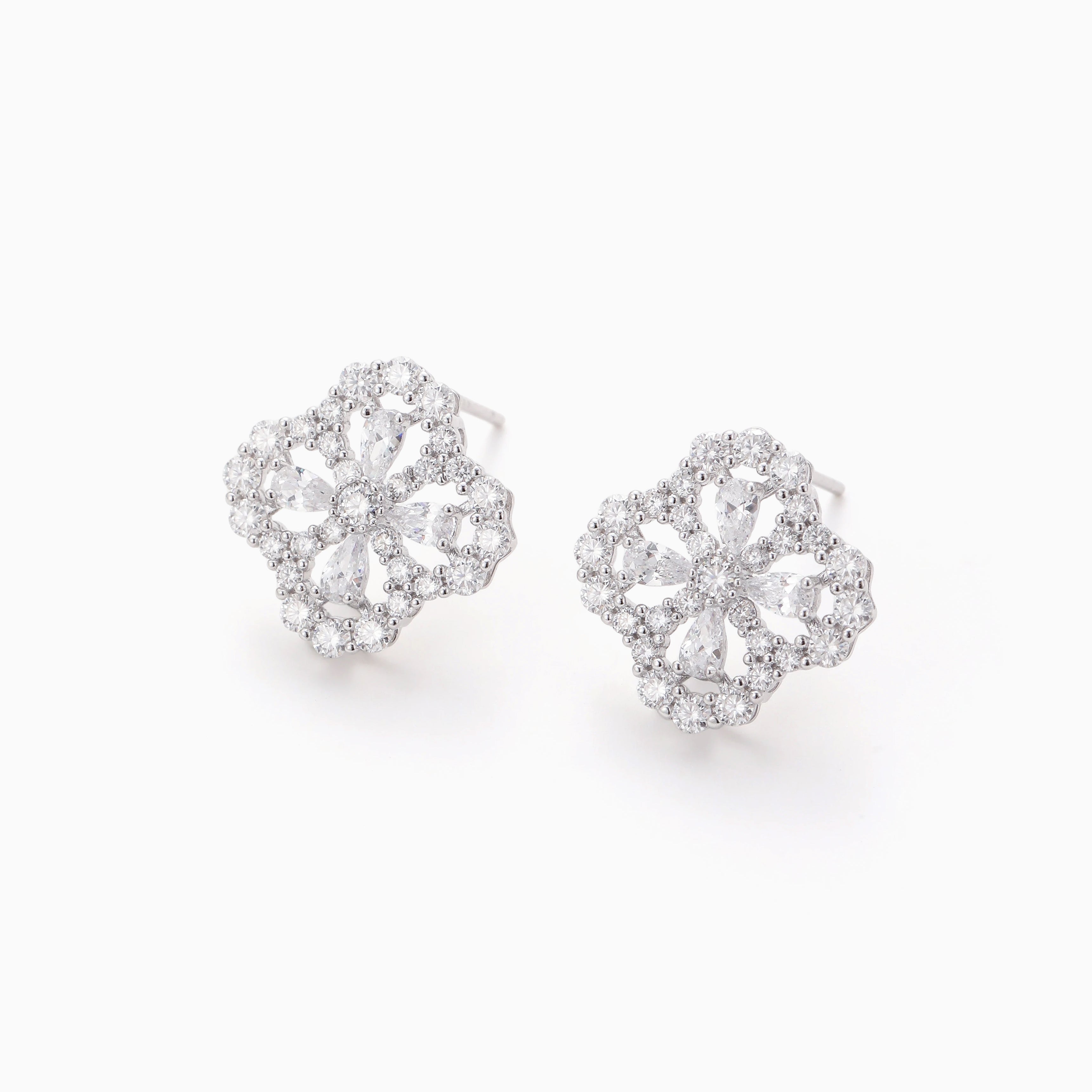 DELICATE OPENWORK FLOWER MOISSANITE STUDS
