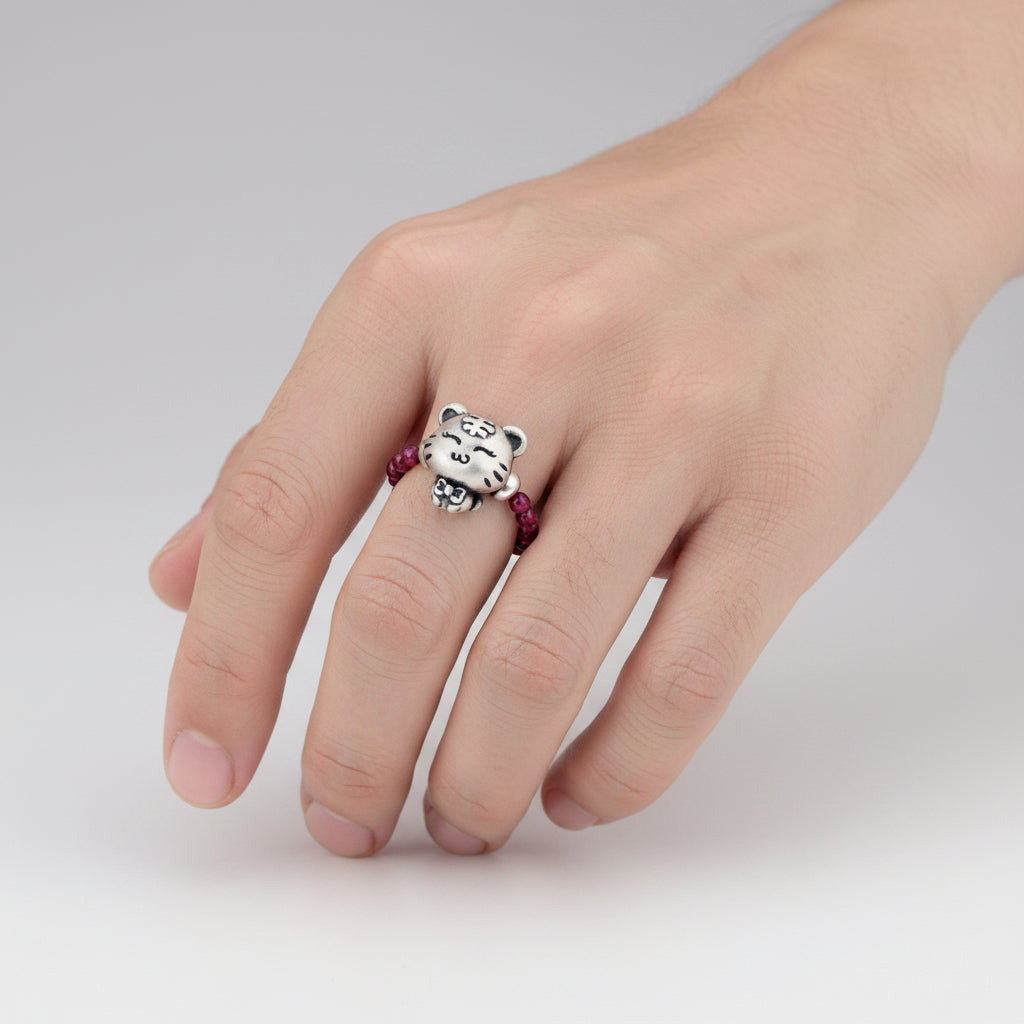 PURPLE GARNET STRETCH RING WITH STERLING SILVER TIGER CHARM