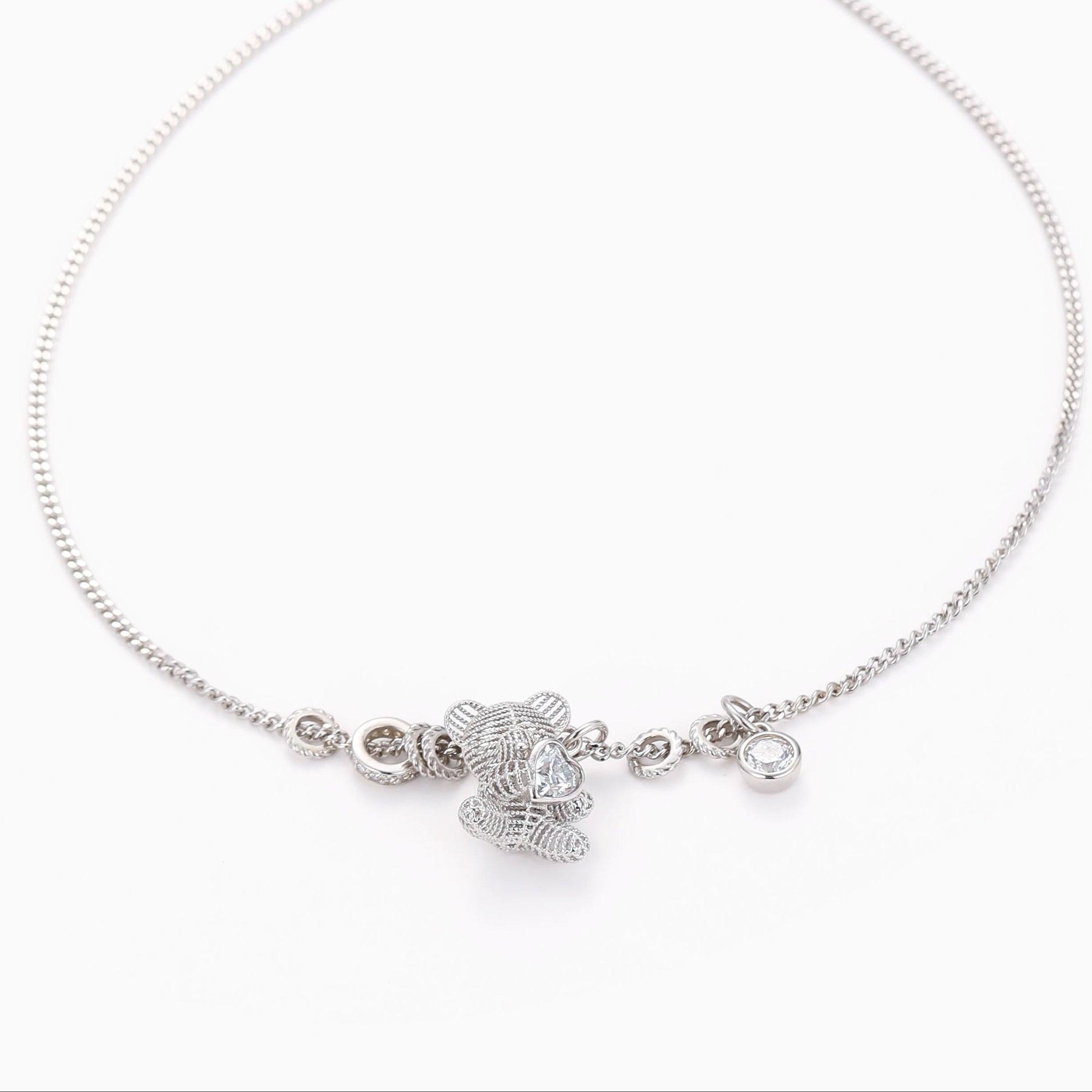 A TENDER EMBRACE TEDDY BEAR PENDANT NECKLACE WITH HEART CZ IN STERLING SILVER