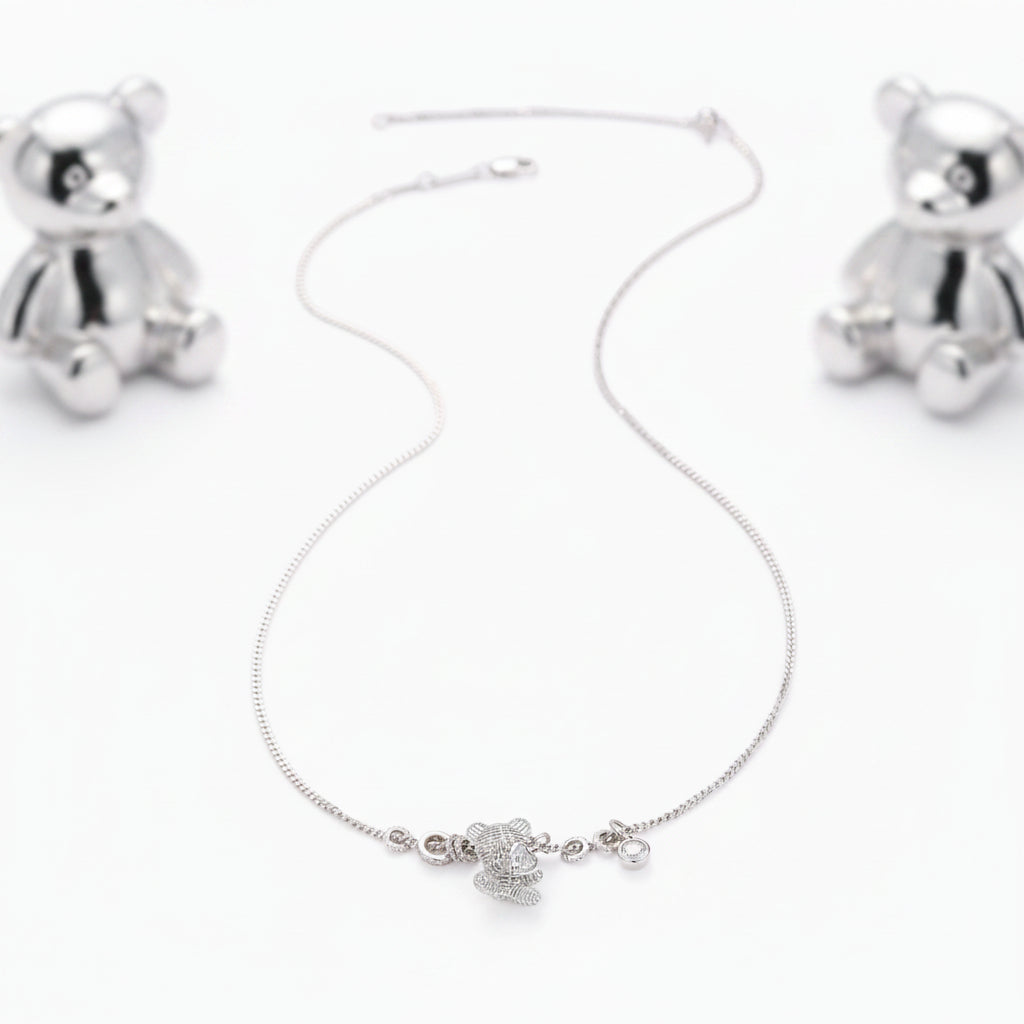 A TENDER EMBRACE TEDDY BEAR PENDANT NECKLACE WITH HEART CZ IN STERLING SILVER