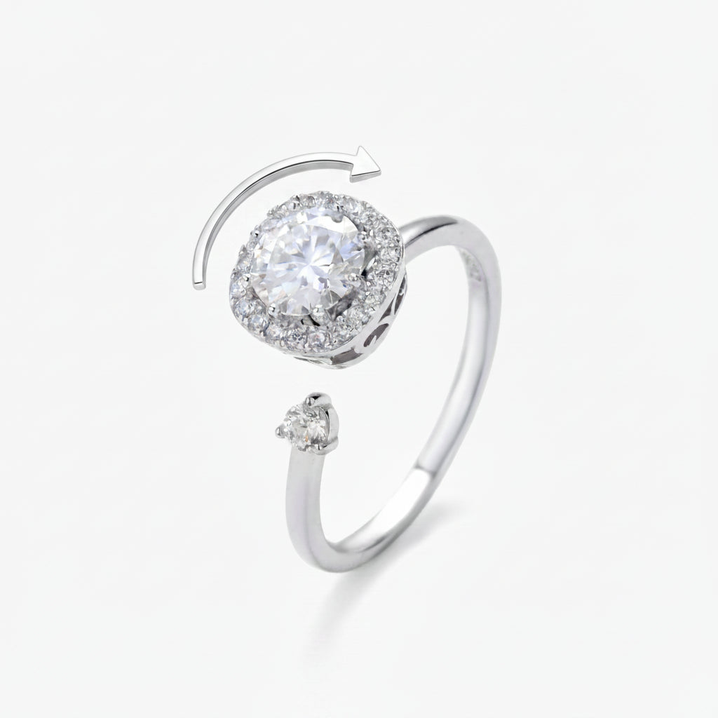 A MOISSANITE HALO SPARKLES BRIGHT IN AN ADJUSTABLE STERLING SILVER RING