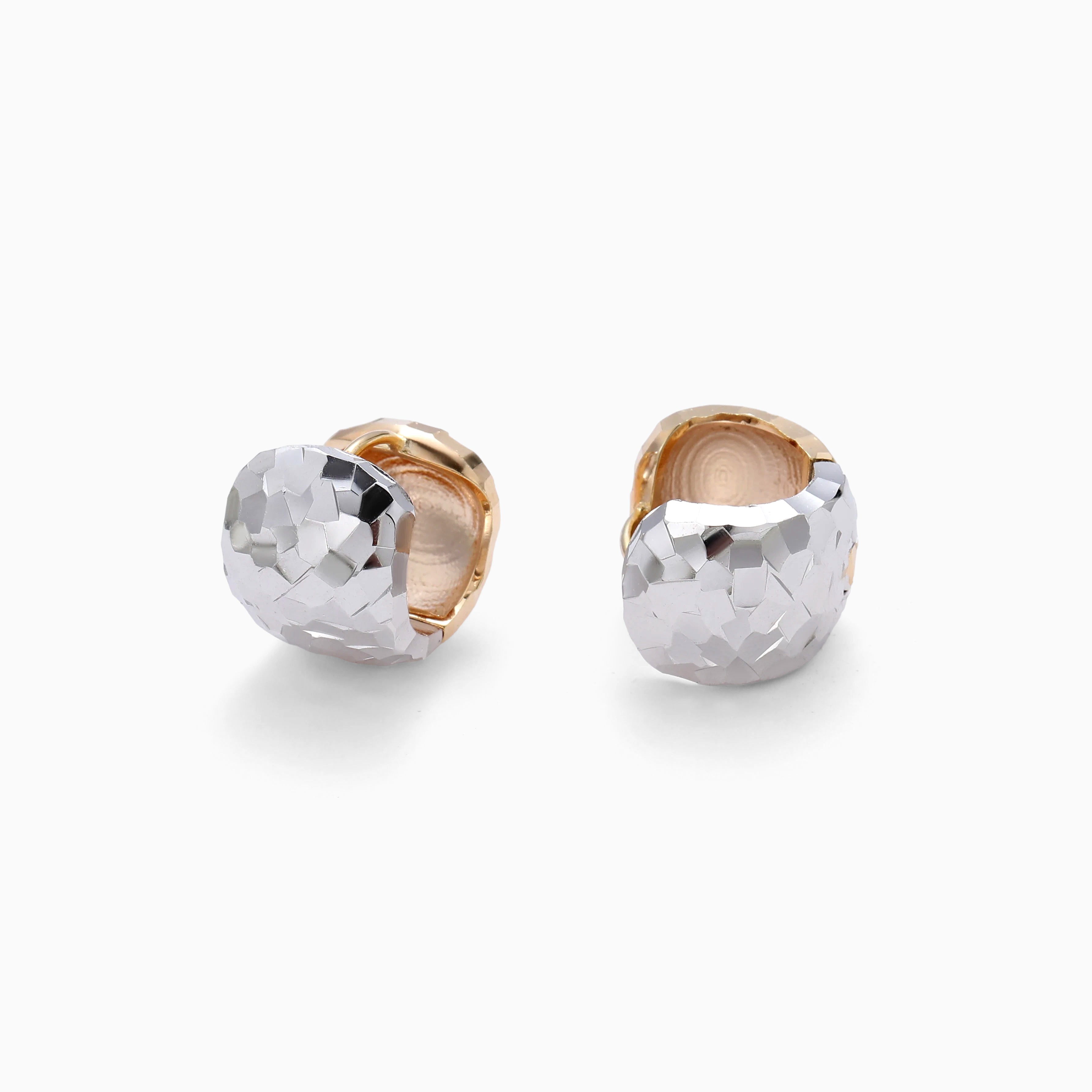 SILVER MEETS GOLD IN HAMMERED HUGGIE HOOPS