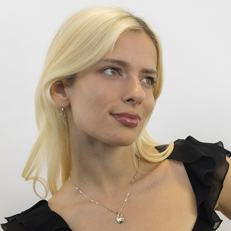 Heart lock necklace worn displaying length and elegant drape