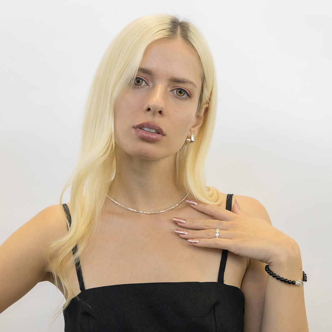 Silver bead necklace worn demonstrating length and drape